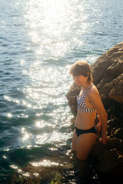 Woman on Rocky Mediterranean Shore