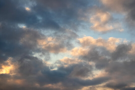 Dramatic sky with dark clouds at sunset
