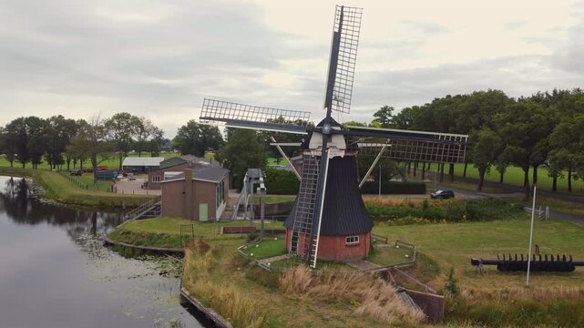 Aerial view of the historic drainage windmill De Boezemvriend, a Dutch polder mill located in the countryside of De Groeve, Netherlands