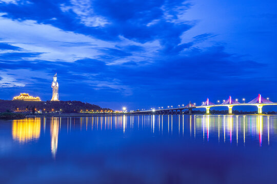 Long exposure dusk photograph of Co Luy Bridge and Chua Minh Duc pagoda together, Quang Ngai Province, Vietnam