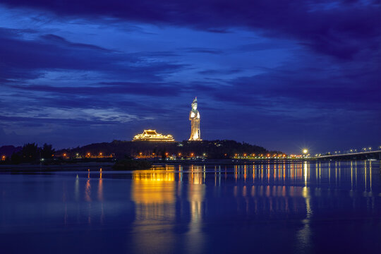Long exposure dusk photograph of Co Luy Bridge and Chua Minh Duc pagoda together, Quang Ngai Province, Vietnam