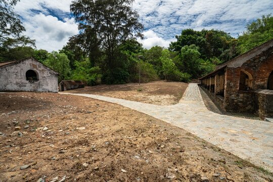 Historic pathway and arched gateway of Khu Biet lap Chuong Bo isolation compound, Con Dao Island, Vietnam