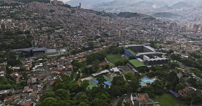 Medellin Colombia Aerial v50 flyover and around ITM campus in Sucre capturing Miraflores gondola lift station and densely populated hillside residential comuna - Shot with Mavic 3 Cine - November 2022