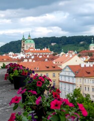 Obraz premium Colorful European town with historic cathedral and blooming flowers.