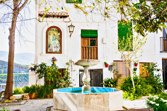 Beautiful Plaza Color&aacute; in the historic Hondillo neighborhood of Lanjar&oacute;n, with its white houses and flowerpots. Alpujarra region, Granada.