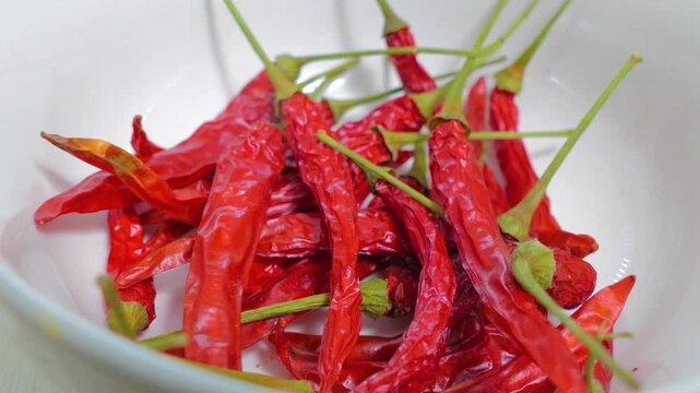 Dried Thai dragon chili peppers in white bowl