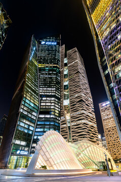 Riyadh, Saudi Arabia - February 19, 2026: Modern skyscrapers, including the Riyad Bank tower, and futuristic architectural installations illuminated at night in the King Abdullah Financial District