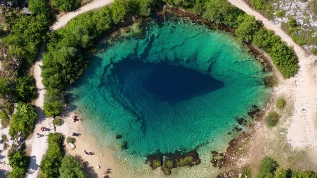 Aerial view of the Cetina River spring, also known as the Eye of the Earth, a karst spring in Croatia with crystal clear turquoise water
