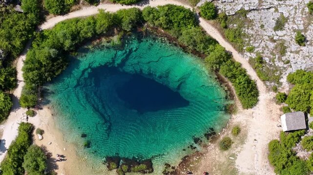 Aerial view of the Cetina River spring, known as the Eye of the Earth, a karst water source in Croatia