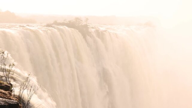 The Zambezi River from the Zambian side, rushing toward the edge of Victoria Falls, Zambia, Africa