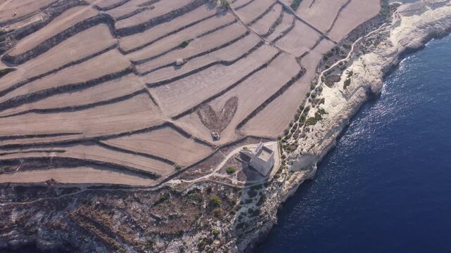 Mgarr ix-Xini Tower, Aerial view, with Heart on the agricultural field nearby. Gozo, Malta. High quality 4k footage