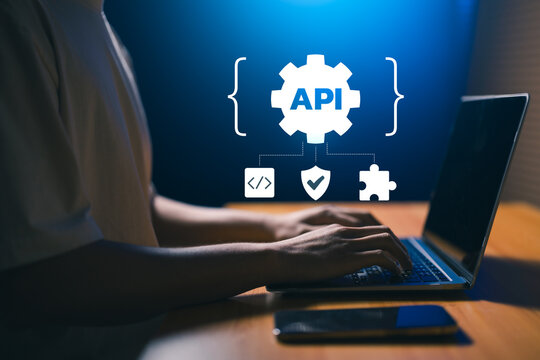 Developer working laptop API integration interface code, security, plugin connector. secure API gateway, software integration, AI automation, application connectivity, developer tool, cloud services