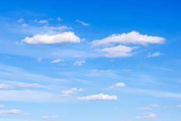 Fototapeta premium few small cirrus and cumulus clouds in blue sky
