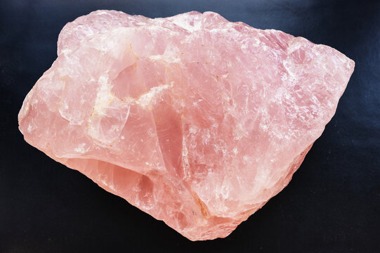 natural rose quartz rock close-up on black