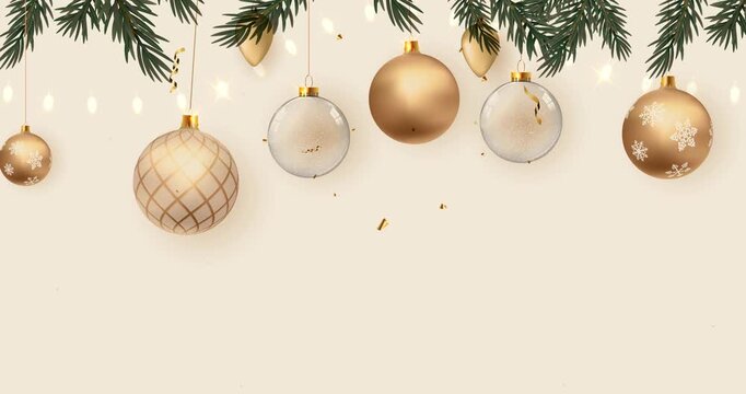 Elegant gold and silver Christmas ornaments hanging on pine branches with festive string lights and glittery decorations