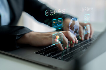 Fototapeta premium Business professional using laptop to analyze data with digital interfaces showing charts and global information, reflecting modern technology and finance analysis. Sentient.