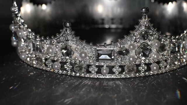 Golden crown with dramatic light on dark background, symbol of authority and prestige. The interplay of shadow and reflection conveys authority, prestige and elevated power.