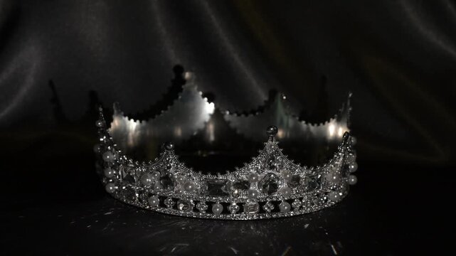 Golden crown with dramatic light on dark background, symbol of authority and prestige. The interplay of shadow and reflection conveys authority, prestige and elevated power.