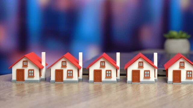 Hand selects a house. Real estate choice, property selection, home buying, investment, housing market, decision making and personal preference