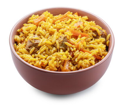 Clay bowl of traditional uzbek lamb pilaf with garlic isolated on a white background. Traditional asian food.