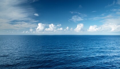Wide Ocean Horizon With Light Cloud Cover