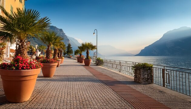 Empty Promenade Limone Sul Garda Early Morning Flower Pots And Palm Trees