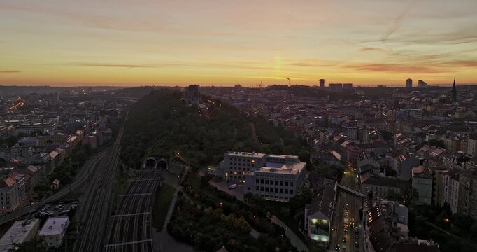 Prague Czechia Aerial v71 drone flyover national memorial on Vitkov Hill capturing peaceful cityscape of Zizkov neighborhood at dawn with morning sunrise views - Shot with Mavic 3 Cine - November 2022