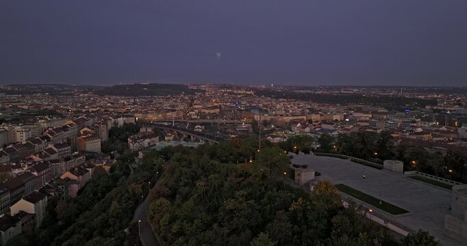 Prague Czechia Aerial v72 cinematic drone flyover Vitkov Hill capturing Florenc cityscape, metro railway tracks and traffic on Wilsonova at dawn - Shot with Mavic 3 Cine - November 2022