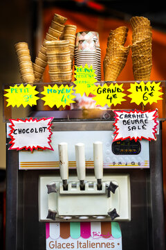 Commercial ice cream maker machine with crispy waffle cones at an amusement park