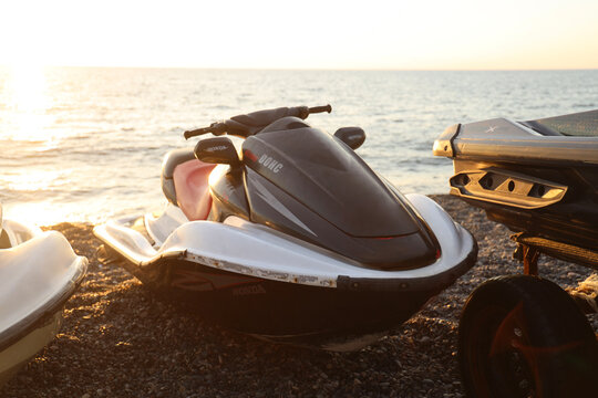 Batumi, Georgia - June 2, 2023: honda dohc 4 stroke aquatrax two jet ski boats on coast of Black sea ocean water waves at sunset Extreme summer sport power action, fast racing holiday vacation Trailer