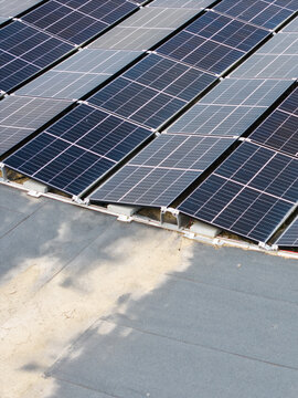 Aerial view of solar panels installed on a flat roof in Malpils, Sigulda Municipality, Latvia.
