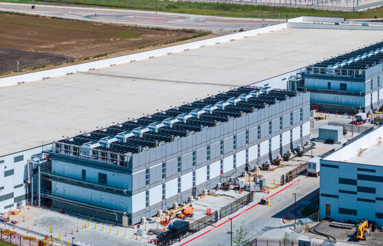 Aerial view of a large data center campus with focus on the processor hosting area and power and cooling infrastructure being built in Hutto TX