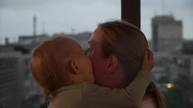 Caucasian mother daughter embracing closely touching foreheads , expressing comfort, trust, emotional support. Useful parenting, family care, bonding, mental wellbeing themes, child having fun mother