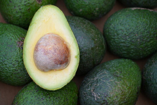 Fresh green avocados at the farmers market