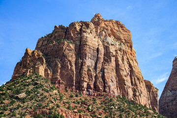 Naklejka premium Angels Landing sandstone monolith rising under a blue sky in Zion National Park
