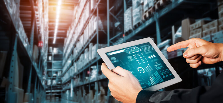 Warehouse management innovative software in computer for real time monitoring of goods package delivery . Computer screen showing smart inventory dashboard for storage and supply chain distribution .