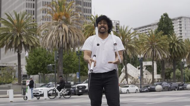 Man Juggling Large Knives Outdoors In Plaza Of San Francisco - Medium Shot