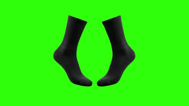 A pair of classic black cotton crew socks isolated on a solid green chroma key screen. This 3D render is ideal for apparel product showcases, commercial advertisements, or fashion design templates.