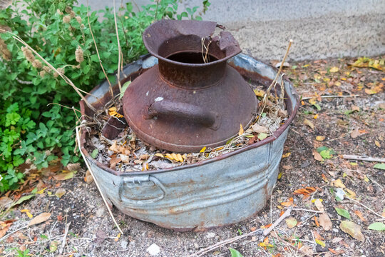 Rusty old can in a metal bucket