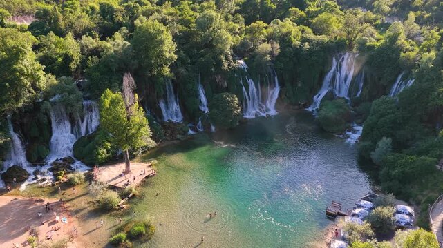 Kravica Waterfall, Bosnia and Herzegovina - June 7, 2026: Aerial panorama of the iconic Kravica Waterfall surrounded by lush summer vegetation