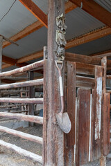 Shovel hanging in a barn © Martina