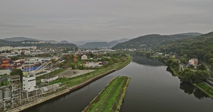 Usti nad Labem Czechia Aerial v1 drone flyover Elbe river channel capturing panoramic views of riverside industrial area, quarry site and hillside cityscape - Shot with Mavic 3 Cine - November 2022
