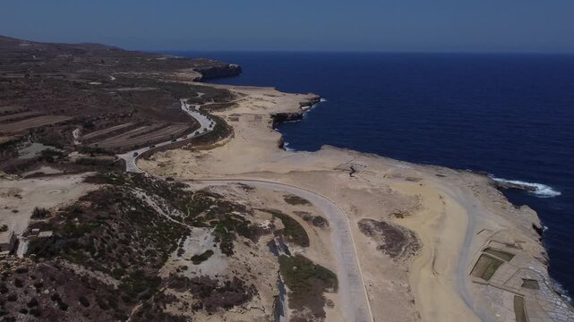 Aerial view of cliffs, Zebbug, Gozo, Malta. WIEHED Gozo two horse statue. High quality 4k footage