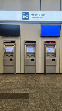 Self-service ticket vending machines for the KCIC Whoosh high-speed train in a modern station concourse