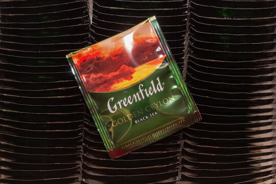 Greenfield golden ceylon black tea sachet placed on top of many other tea bags