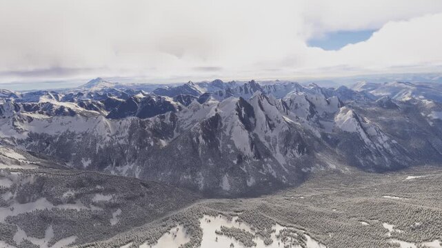 Side aerial drone view of the snow at MacDonald Peak in Fraser Valley. Canada