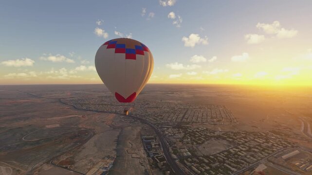 Circular aerial view at sunset of The Great Pyramids in Air Balloon Ride in Al Haram. Giza. Egypt