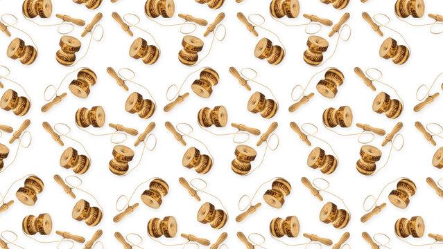 Wooden chilean emboque or cup and ball toys creating a seamless pattern on a white background