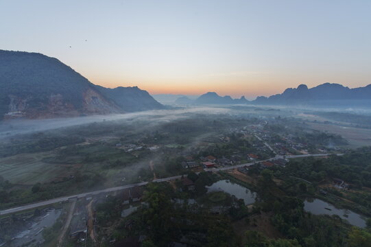 aerial view of morning fog over the village in laos