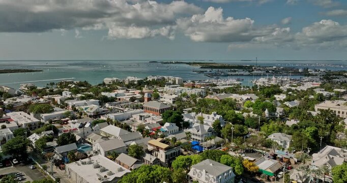 Key West Florida Aerial v15 flyover the town above Duval street towards Simonton beach capturing downtown commercial zone, marina and Fleming Key Island views - Shot with Mavic 3 Cine - April 2022